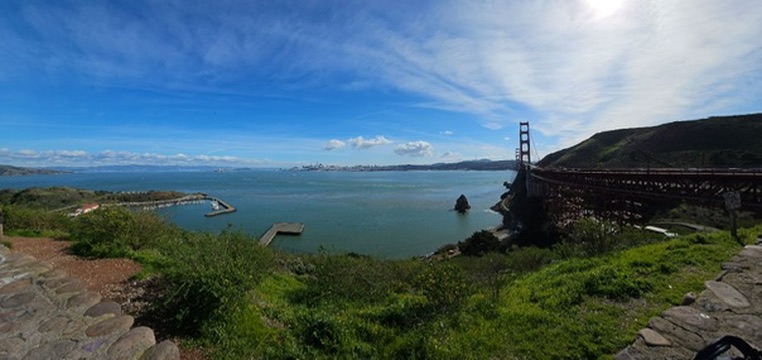 Panorama of the Golden Gate Bridge and the bay under a blue sky