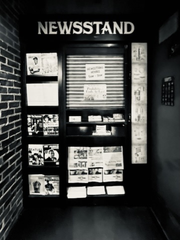 Black-and-white newsstand, shutter down